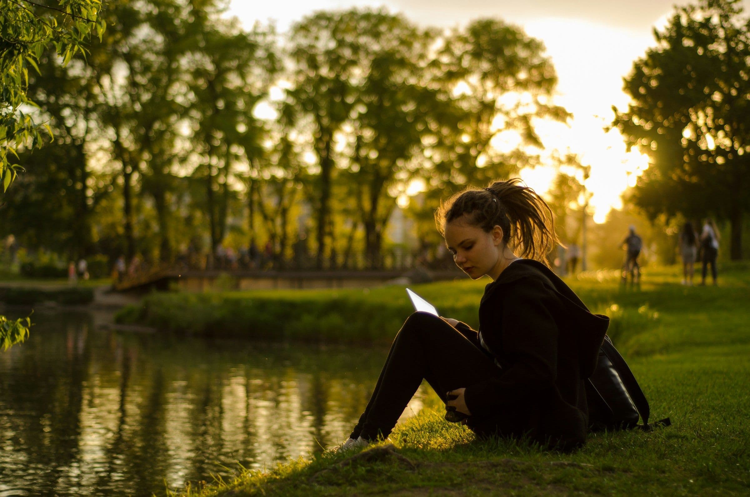 student near a pond - Free Apps for College Students