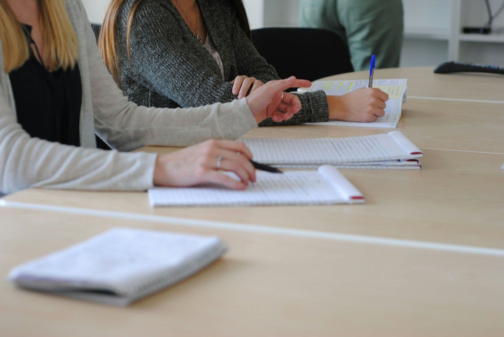 students writing down - Why Is It Important to Take Notes During Lectures or Discussions?