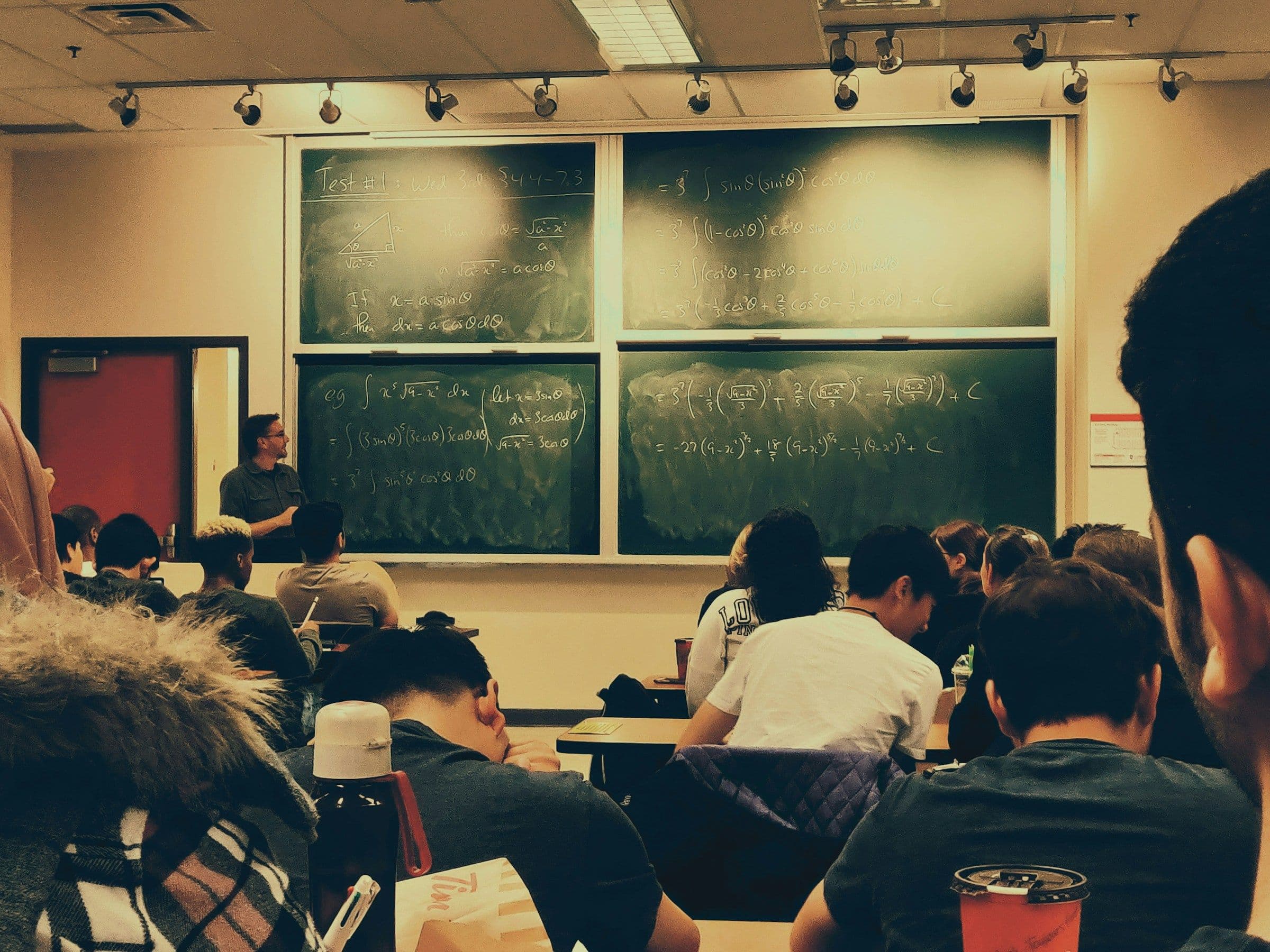 Teacher Teaching in Class - How to Get Better at Math