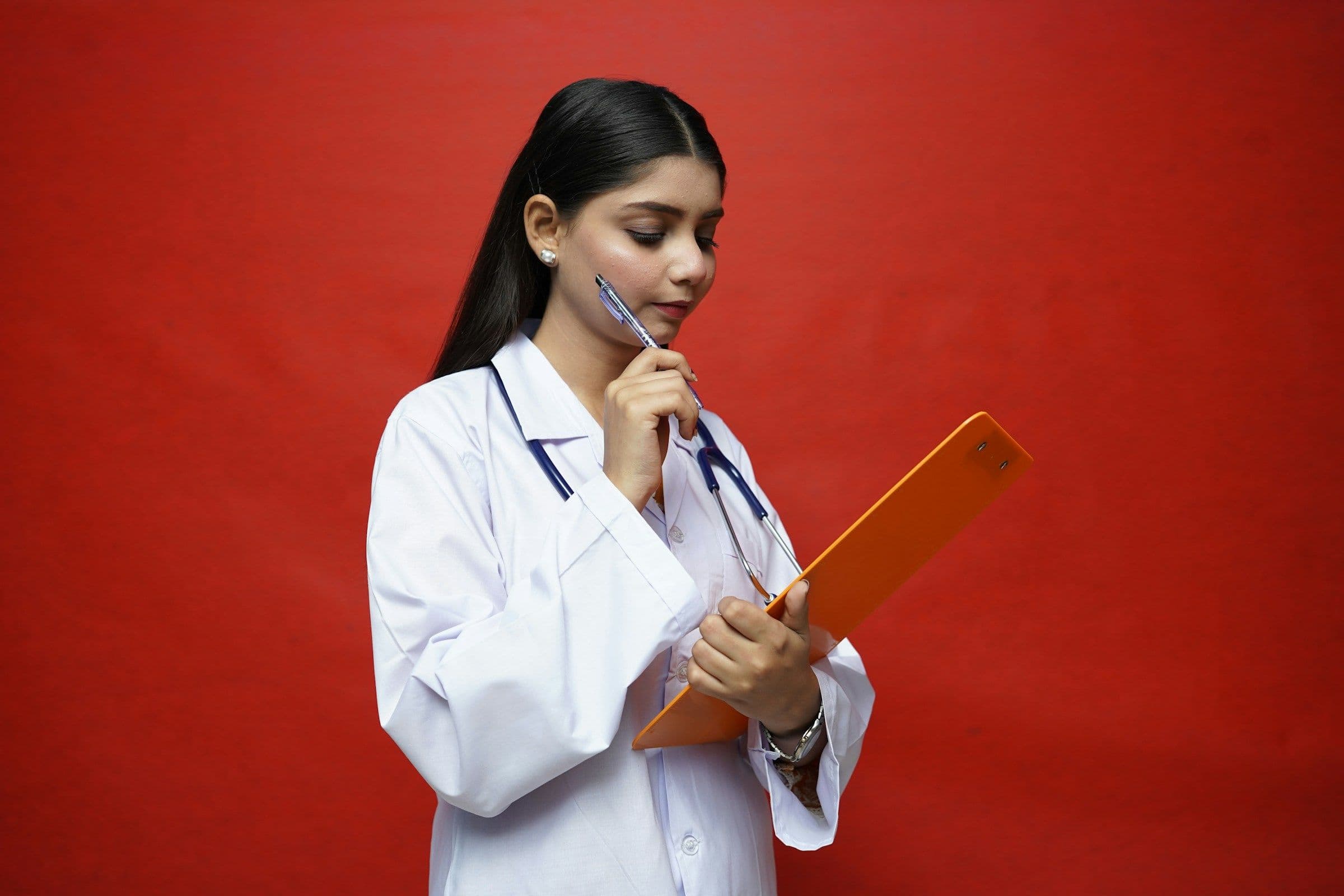 Girl Holding Pen - How To Study For Anatomy